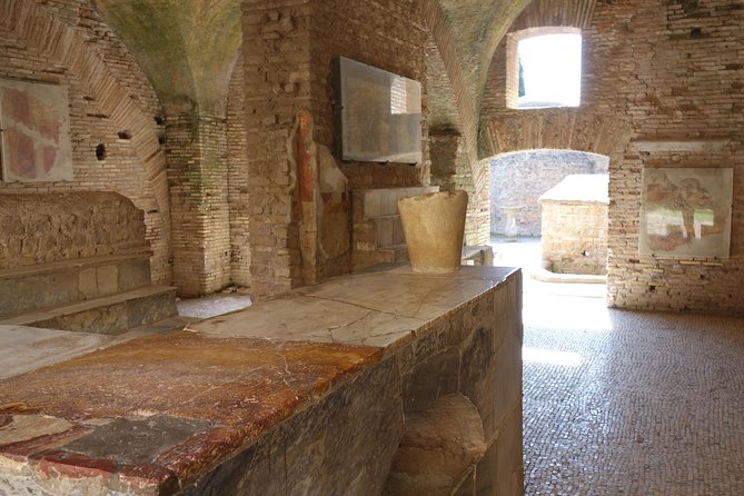 Ancient Ostia Antica Semi-Private Day Trip from Rome by Train with Guide - The Baths of Neptune and their sea-god mosaic