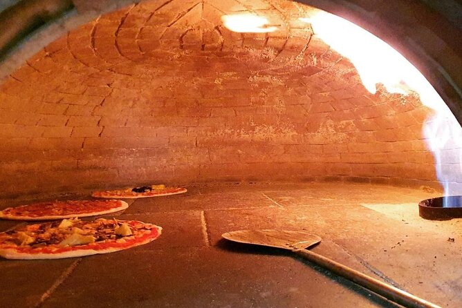 Cooking Class in the Heart of Rome: Pizza and Tiramisu Making - Making pizza in central Rome