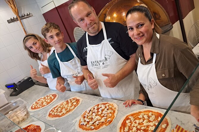 Cooking Class in the Heart of Rome: Pizza and Tiramisu Making - Sitting down to eat what you made