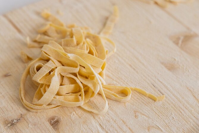Enjoy Spritz and Pasta Making in Piazza Navona - Sitting down to a Roman-style group meal