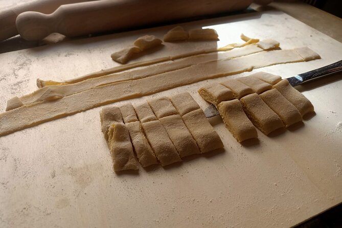 From Rome: Pasta & Tiramisù Cooking Class near Spanish Steps - Cutting the strands and sitting down to lunch