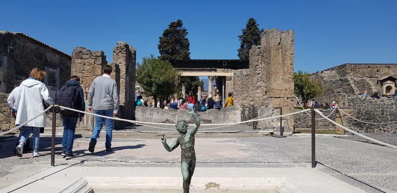 Pompeii: Entry Ticket w/ Guide and Transfers or Audio Guide - Baths, bakeries, and shops that explain daily life