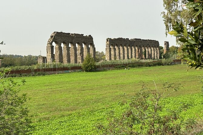 Private E-bike tour of Appian way, Aqueduct & catacombs with food - Porta San Sebastiano sets the Roman scene