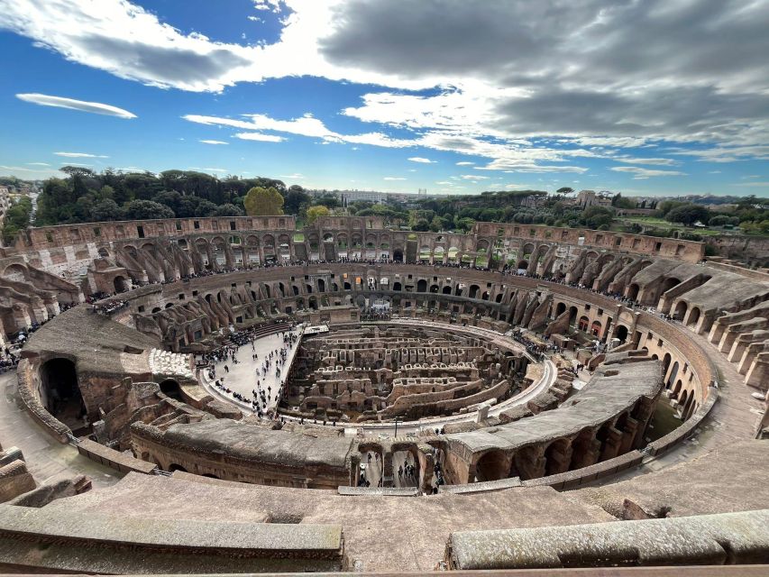 Rome: Colosseum and Ancient Rome Guided Walking Tour - Entering the Colosseum and seeing the arena