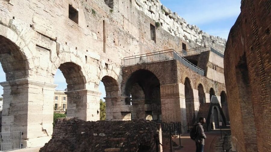 Rome: Colosseum Arena and Ancient Rome Guided Tour - Walking through the Roman Forum
