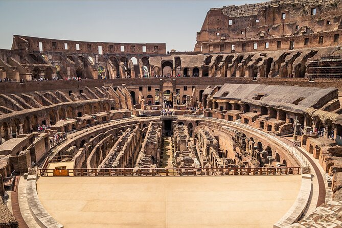 Rome: Colosseum, Arena Floor & Ancient City Group Tour - Entering the Colosseum and Understanding the Arena