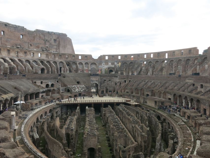 Rome: Colosseum Arena Floor, Roman Forum & Palatine Tour - Walking through the Roman Forum’s ancient center