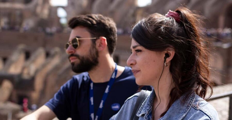 Rome: Colosseum, Forum, & Palatine Hill Entry & Audioguide - Entering the Colosseum With a Phone Audio Guide