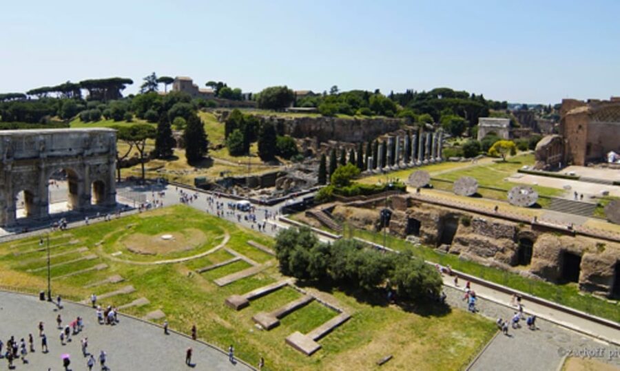 Rome: Colosseum, Palatine Hill, and Roman Forum Tour - Walking through the Roman Forum