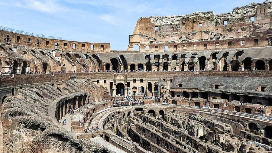 Rome: Colosseum, Roman Forum & Palatine Guided Tour - Entering the Colosseum with the story in place