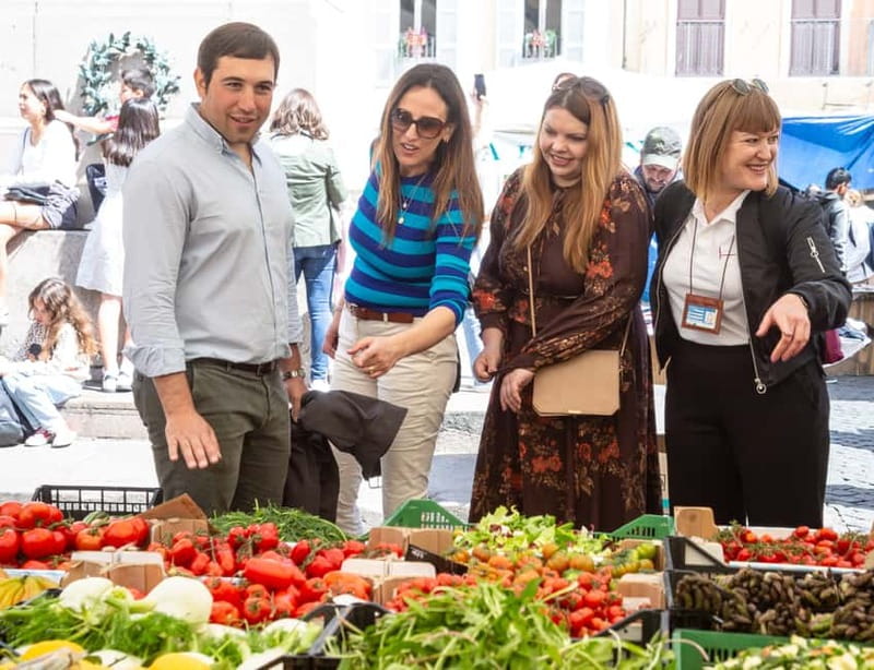 Rome: Eat Like a Roman Ghetto & Campo de' Fiori Food Tour - Supplì and porchetta, two Roman staples