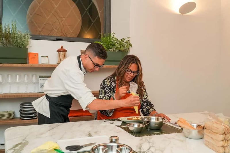 Rome: Hands-On Pasta & Tiramisu Class with Unlimited Wine - Building tiramisu from espresso and mascarpone