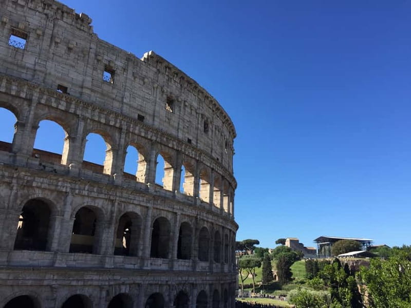 Rome: Mamertine Prison, Colosseum Experience, & Audio Guide - Entering the Colosseum with an audio guide