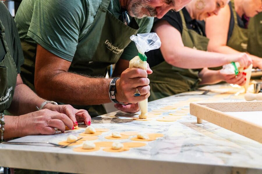 Rome: Pasta, Ravioli & Tiramisu Cooking Class by Colosseum - Wine, food, and the final meal