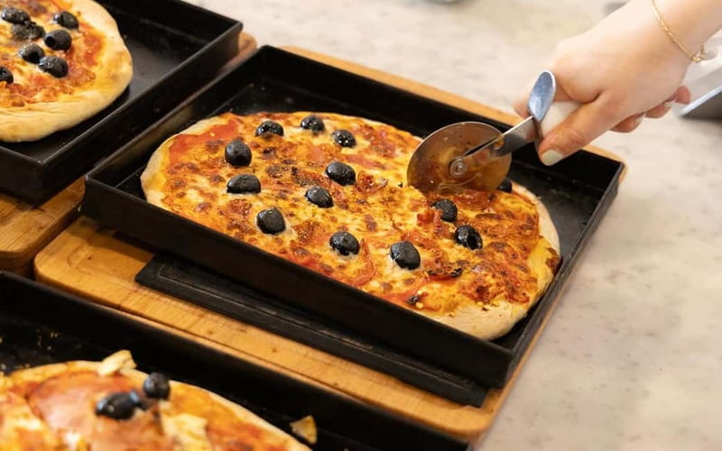 Rome: Pizza and Tiramisù Cooking Class with Glass of Wine - Learning from chefs who keep the room lively