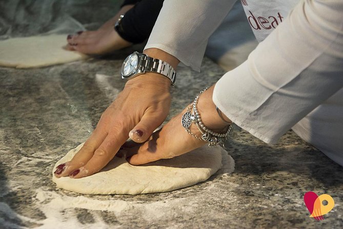 Rome: Pizza Making Class Small Group Experience - Shaping the pizza and choosing toppings